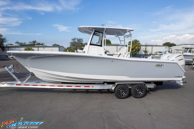Slide: The Image of 2026 Sea Hunt Gamefish 30 Coffin Box boat on trailer, side view. - 8