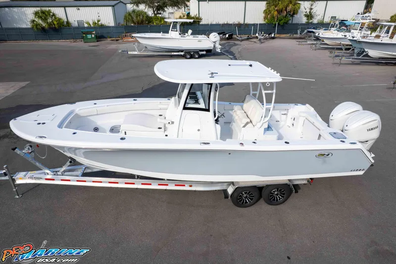 Slide: The Image of 2026 Sea Hunt Gamefish 30 Coffin Box boat on trailer, side view. - 9
