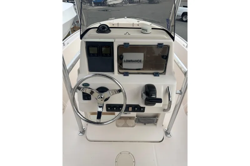 Slide: The Image of 2008 Grady White 180 Sportsman boat console with steering wheel and Lowrance equipment. - 3