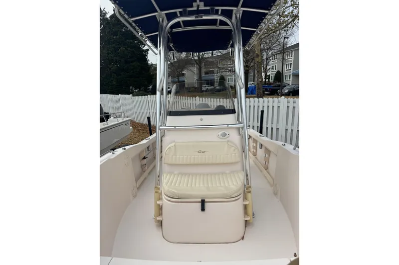 Slide: The Image of 2008 Grady White 180 Sportsman boat with seating and canopy, parked outdoors. - 7