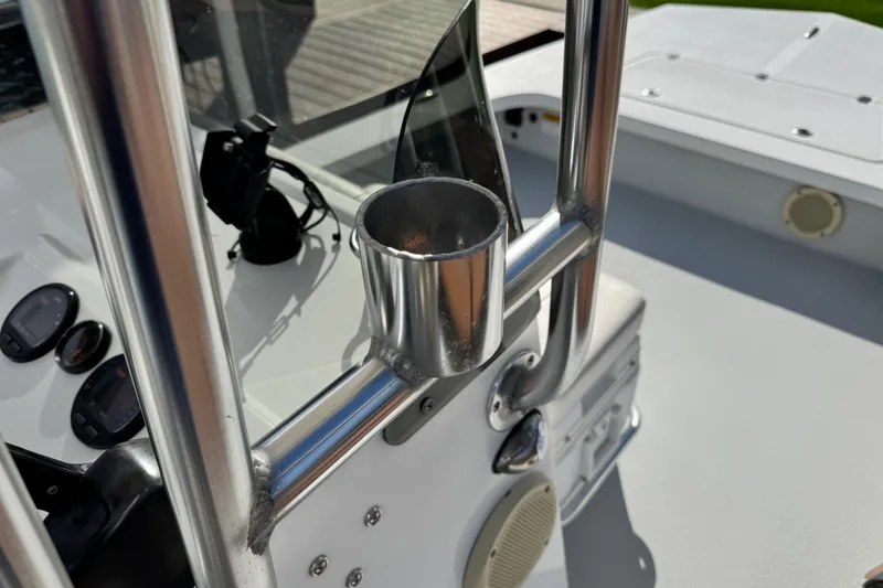 Slide: The Image of 2012 Majek Illusion 226 boat console with stainless steel cup holder and gauges. - 11
