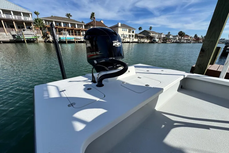 Slide: The Image of 2012 Majek Illusion 226 boat with Yamaha engine docked by waterfront homes. - 20