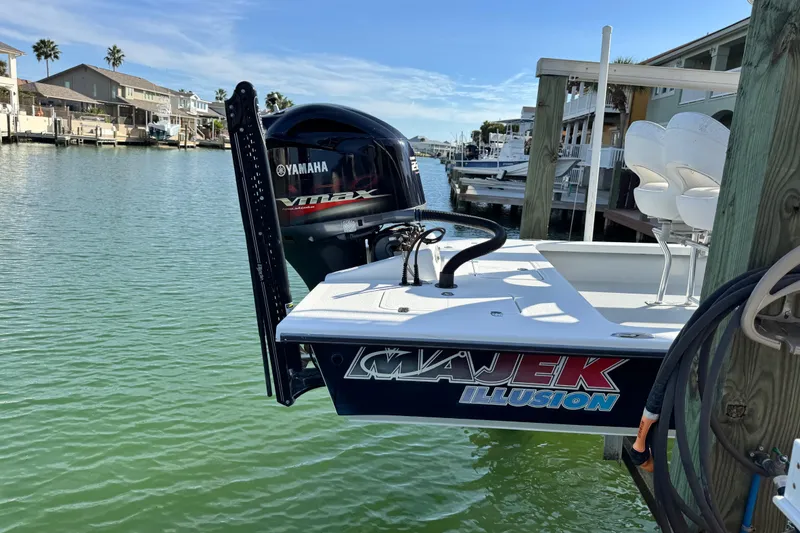 Slide: The Image of 2012 Majek Illusion 226 boat with Yamaha VMAX engine docked by waterfront homes. - 5