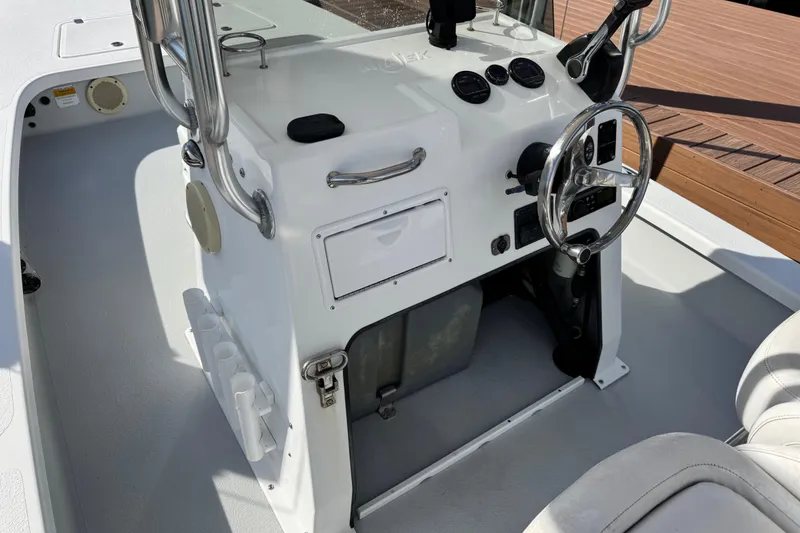 Slide: The Image of 2012 Majek Illusion 226 boat console with steering wheel and gauges. - 7