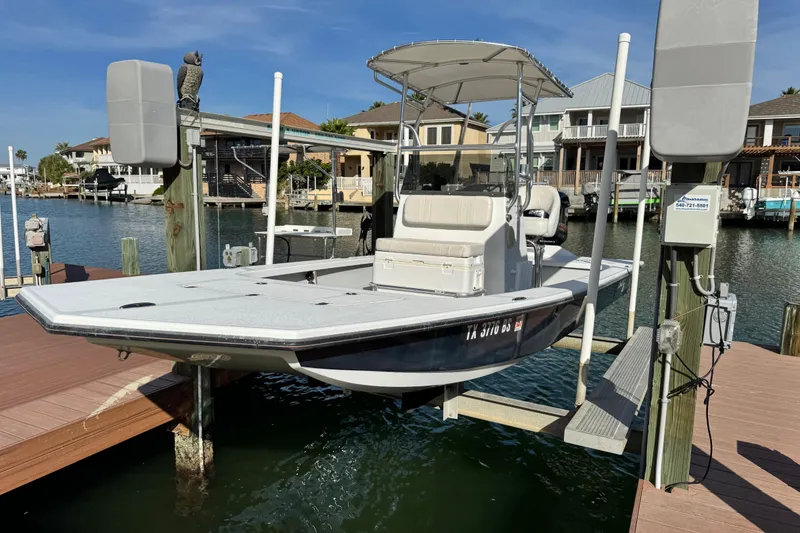 Slide: The Image of 2012 Majek Illusion 226 boat docked in a scenic waterfront setting. - 1