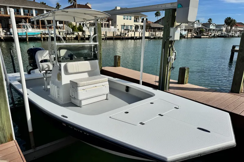 Slide: The Image of 2012 Majek Illusion 226 boat docked by waterfront homes. - 2