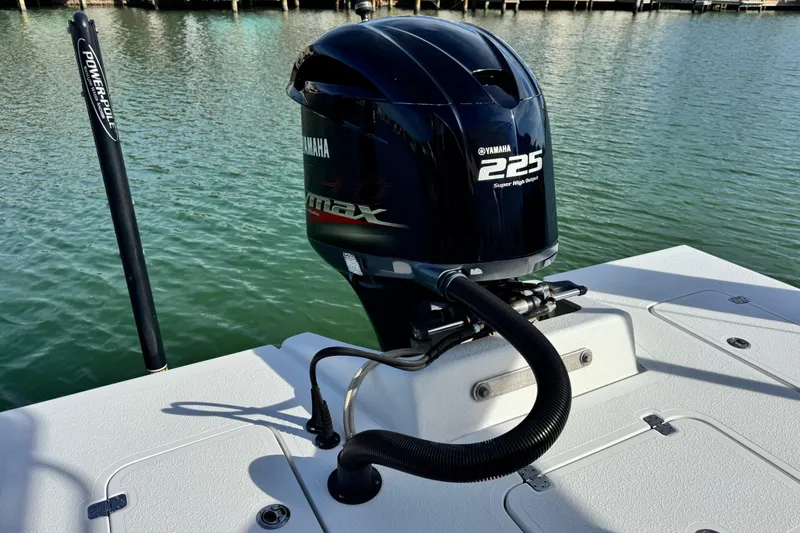 Slide: The Image of 2012 Majek Illusion 226 boat with Yamaha 225 engine on calm water. - 6