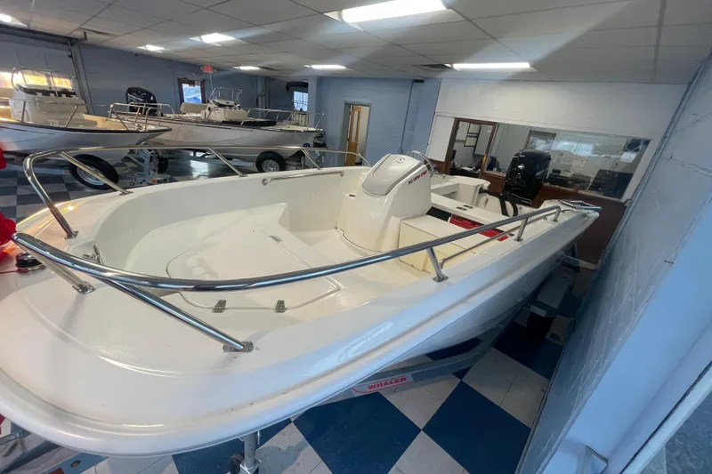 Slide: The Image of 2026 Boston Whaler 160 Super Sport in showroom. - 4
