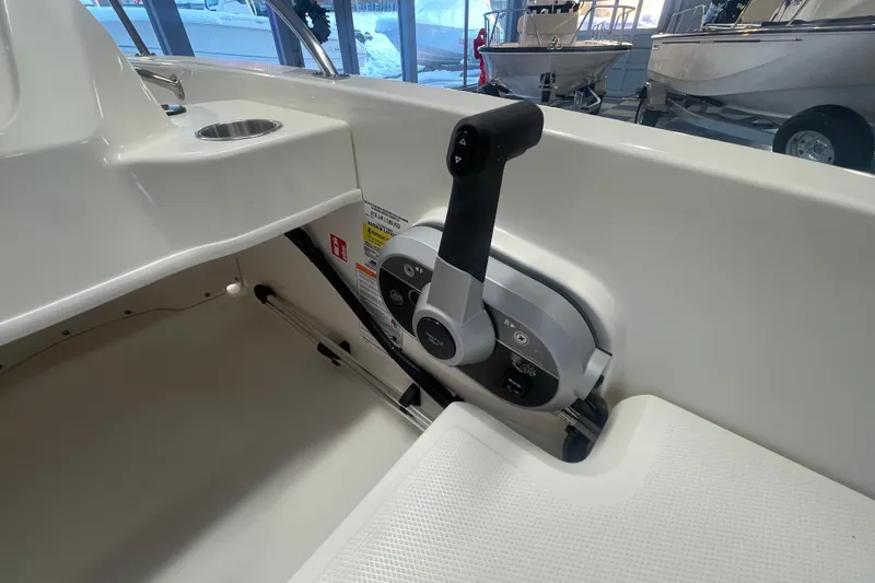 Slide: The Image of Interior of 2026 Boston Whaler 160 Super Sport with control lever. - 6