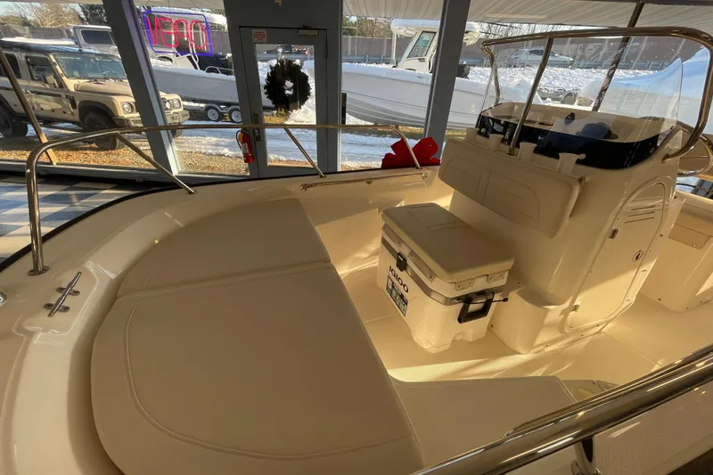Slide: The Image of Interior view of 2026 Boston Whaler 150 Montauk boat in showroom. - 11
