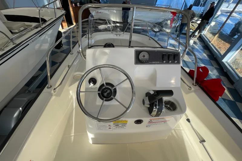 Slide: The Image of Boston Whaler 150 Montauk 2026 steering console. - 7