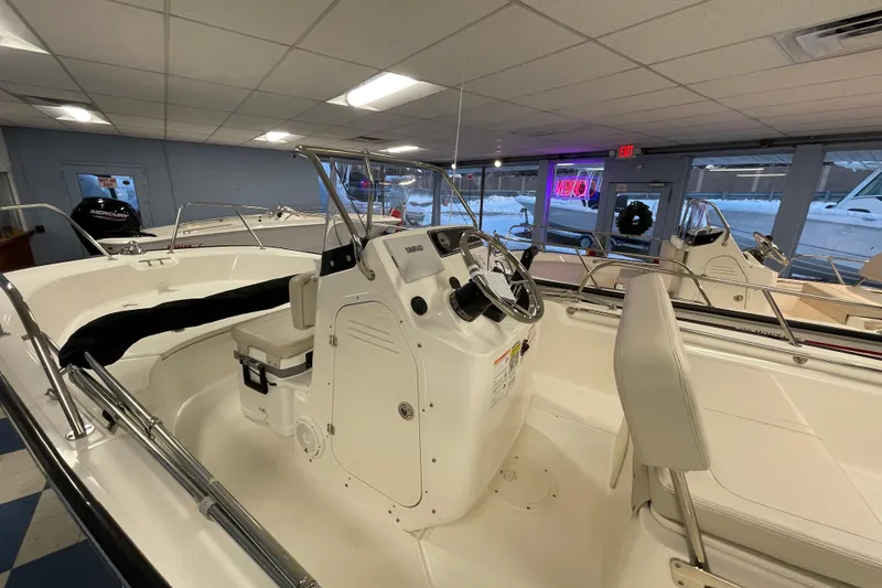 Slide: The Image of Interior view of a 2026 Boston Whaler 170 Montauk boat in showroom. - 10