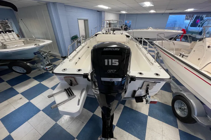 Slide: The Image of Boston Whaler 170 Montauk 2026 with Mercury 115 engine in showroom. - 5