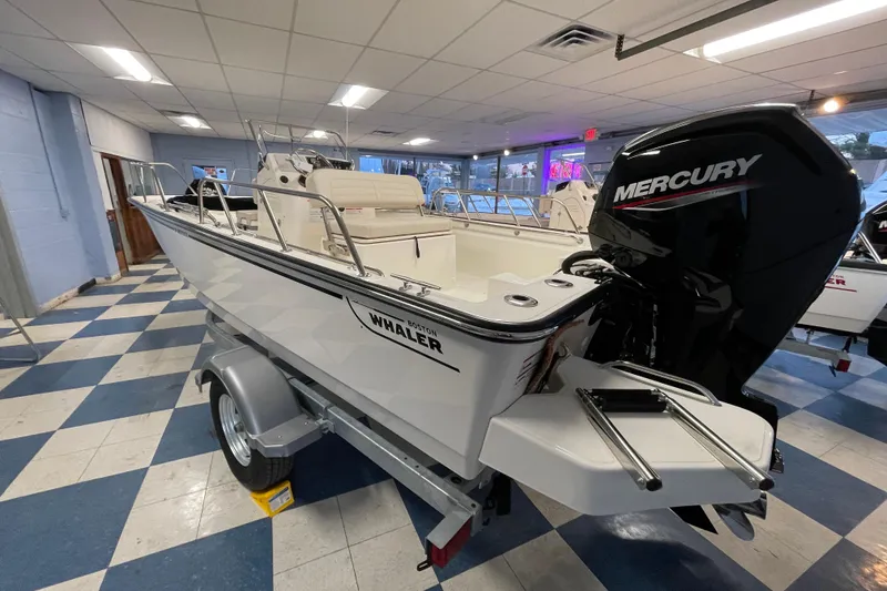 Slide: The Image of 2026 Boston Whaler 170 Montauk with Mercury engine in showroom. - 6