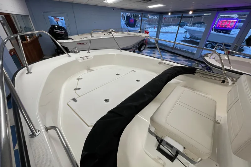 Slide: The Image of Interior view of a 2026 Boston Whaler 170 Montauk boat in showroom. - 7