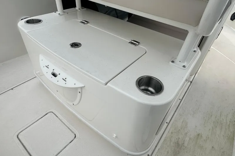 Slide: The Image of Interior of 2025 Boston Whaler 220 Dauntless with cup holders. - 16