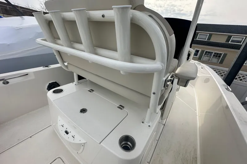Slide: The Image of Boston Whaler 220 Dauntless 2025, seating area and storage. - 17