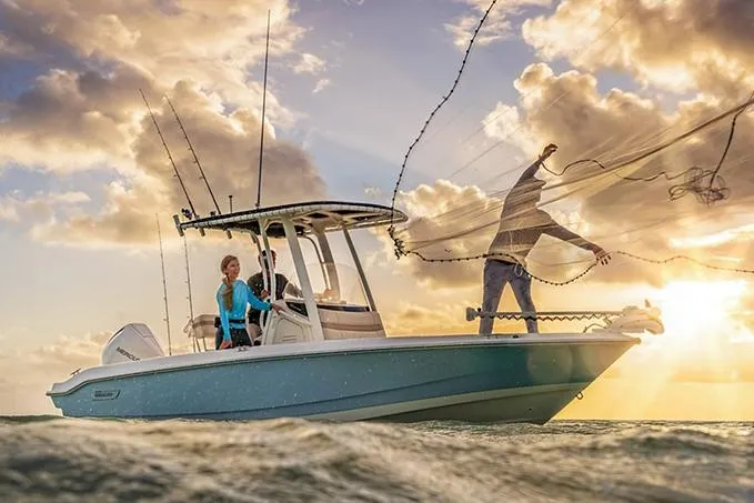 Slide: The Image of Manufacturer Provided Image: 2026 Boston Whaler 220 Dauntless boat on water at sunset, people fishing. - 18