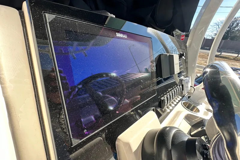 Slide: The Image of Dashboard of 2026 Boston Whaler 250 Dauntless with Simrad display. - 14