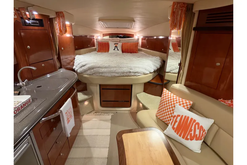 Slide: The Image of Luxurious interior of 2007 Sea Ray 340 Sundancer yacht with cozy bed and seating area. - 13