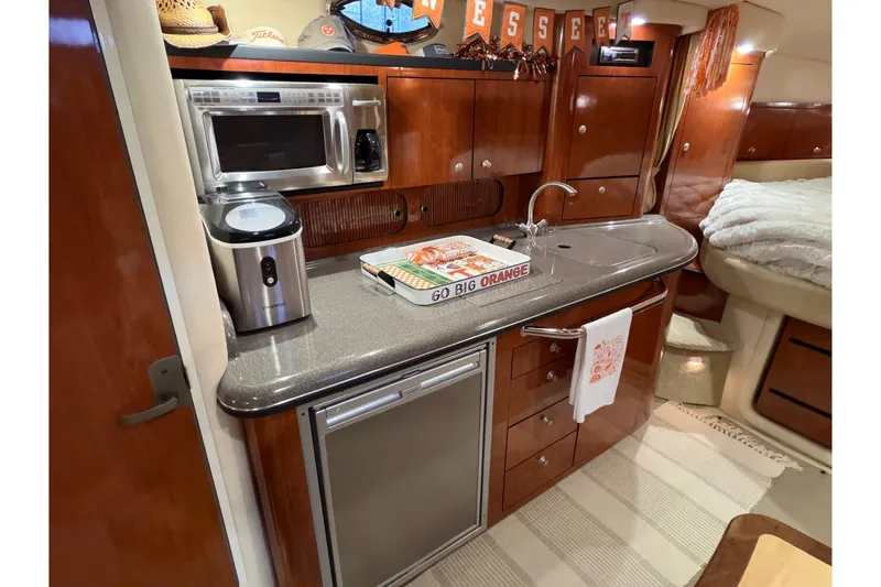 Slide: The Image of Luxurious 2007 Sea Ray 340 Sundancer yacht interior with modern kitchen amenities. - 14