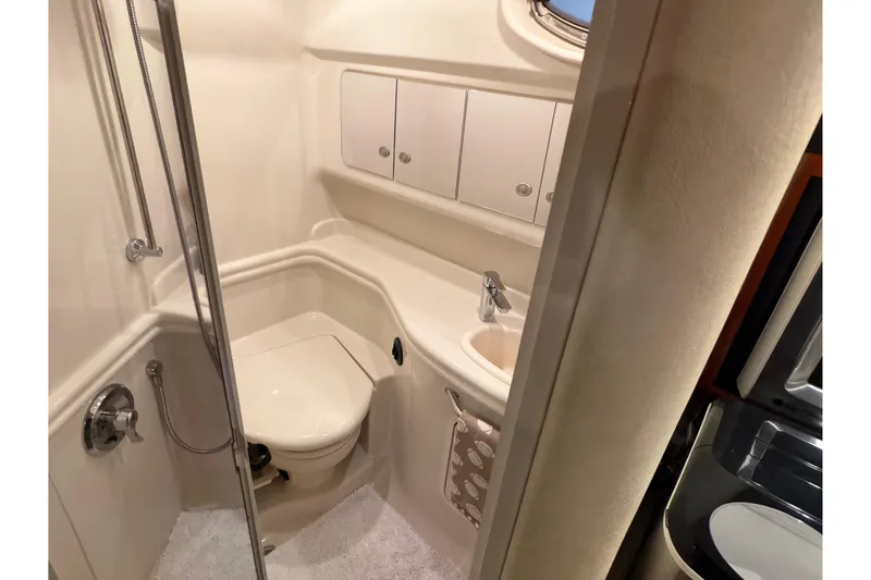 Slide: The Image of Bathroom interior of 2007 Sea Ray 340 Sundancer yacht, featuring shower and sink. - 19