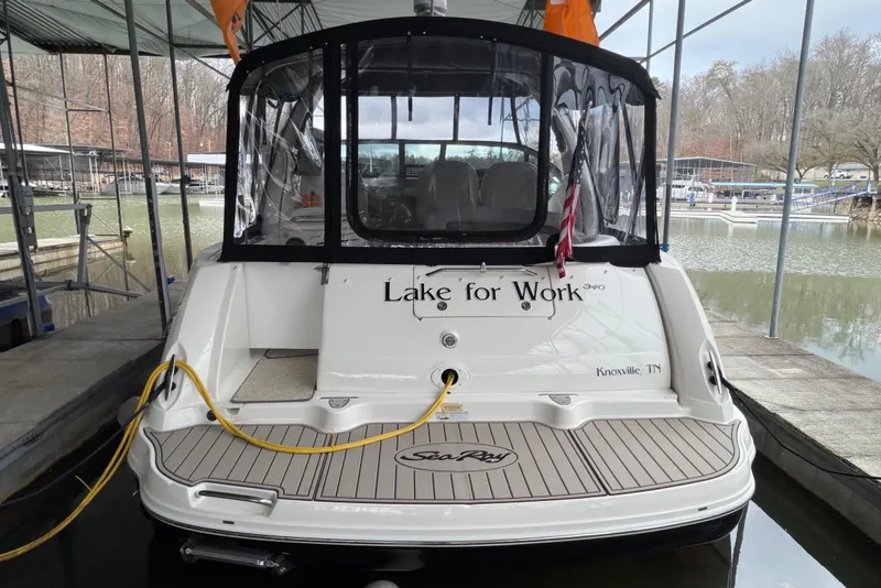 Slide: The Image of 2007 Sea Ray 340 Sundancer docked, rear view with "Lake for Work" name, Knoxville, TN. - 2
