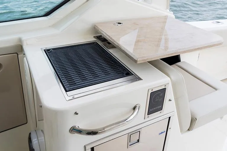 Slide: The Image of Boston Whaler 280 Vantage 2026 helm with control panel. - 15