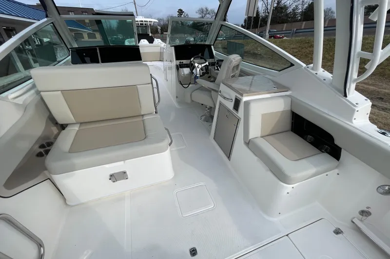Slide: The Image of Interior of 2026 Boston Whaler 280 Vantage with seating and helm station. - 24