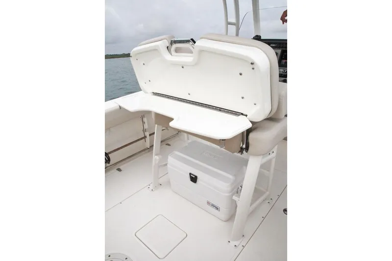 Slide: The Image of Seating area of the 2026 Boston Whaler 230 Outrage boat. - 11