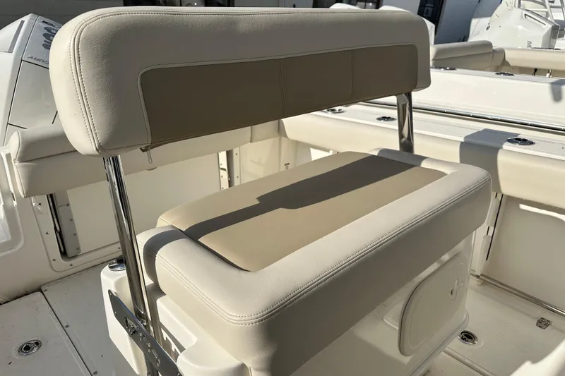 Slide: The Image of Boston Whaler 230 Outrage 2026 seat with cream leather upholstery. - 18