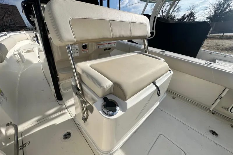 Slide: The Image of Interior of 2026 Boston Whaler 230 Outrage with beige seating. - 20