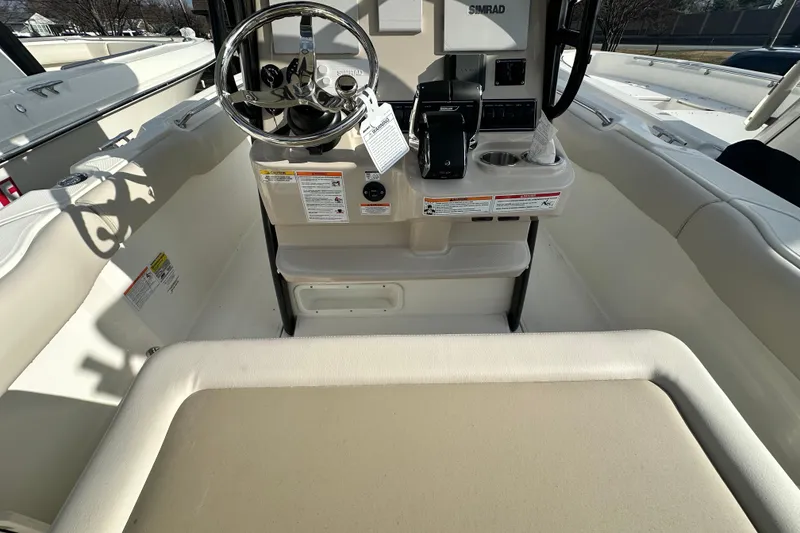 Slide: The Image of Interior view of the 2026 Boston Whaler 230 Outrage boat. - 23