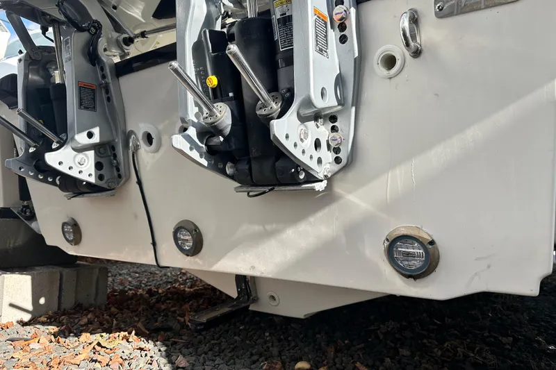 Slide: The Image of Rear view of Boston Whaler 230 Outrage 2026 with motor mounts. - 24