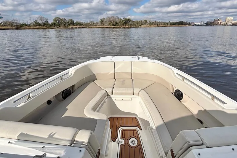 Slide: The Image of 2021 Boston Whaler 320 Vantage boat interior with spacious seating on calm water. - 20