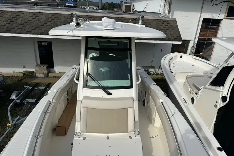 Slide: The Image of 2025 Boston Whaler 250 Outrage boat in dock. - 3