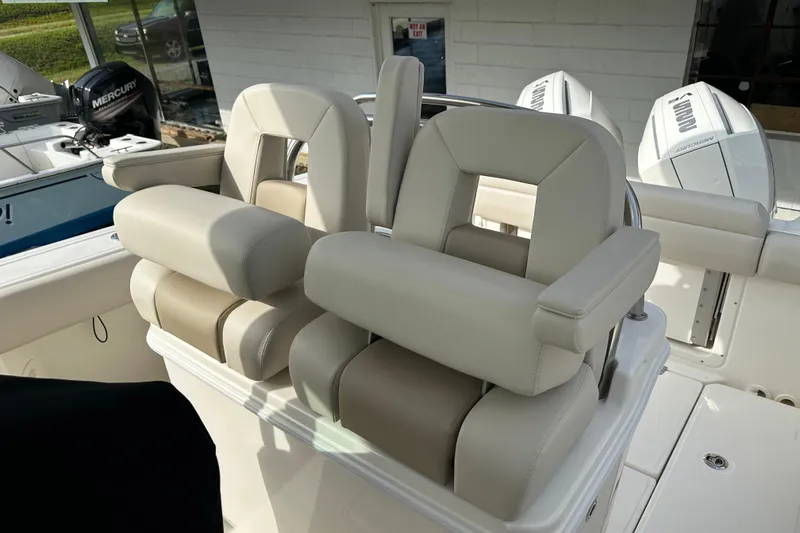 Slide: The Image of Boston Whaler 250 Outrage 2025, luxurious cockpit seating area. - 7