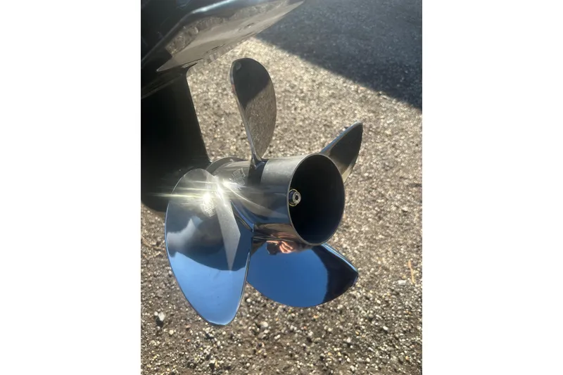 Slide: The Image of Shiny propeller of 2026 Delta Boatworks Delta D245 on gravel background. - 13