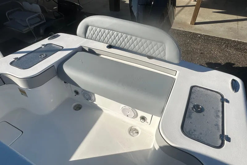 Slide: The Image of 2026 Delta Boatworks Delta D245 interior with cushioned seating and storage compartments. - 14