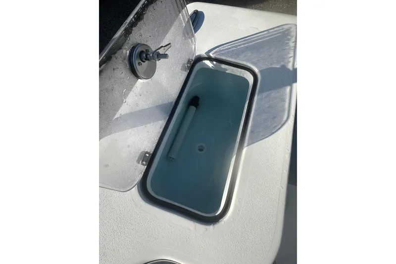 Slide: The Image of Open storage compartment on 2026 Delta Boatworks Delta D245 boat deck. - 16