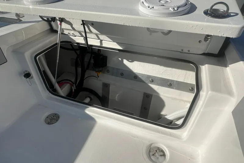 Slide: The Image of Open storage compartment on 2026 Delta Boatworks Delta D245 boat deck. - 17