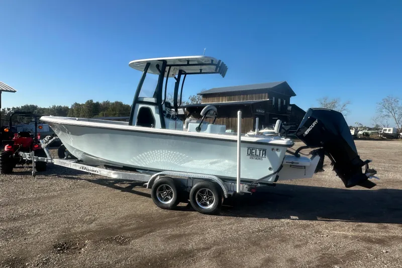 Slide: The Image of 2026 Delta Boatworks Delta D245 on trailer, featuring sleek design and powerful Mercury engine. - 2