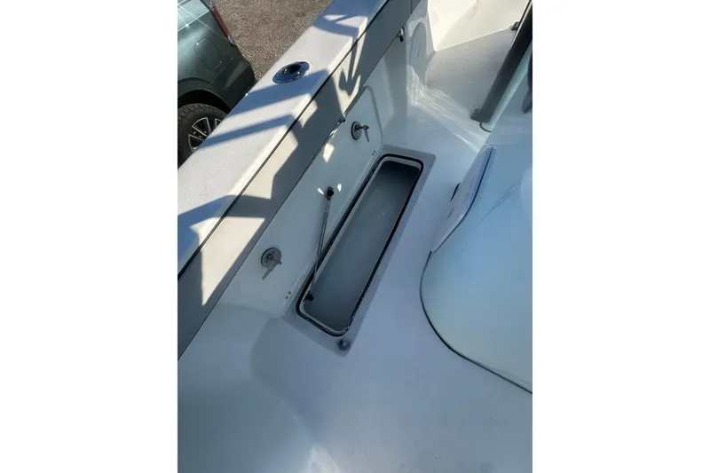 Slide: The Image of 2026 Delta Boatworks Delta D245 deck with storage compartment and sleek design. - 21