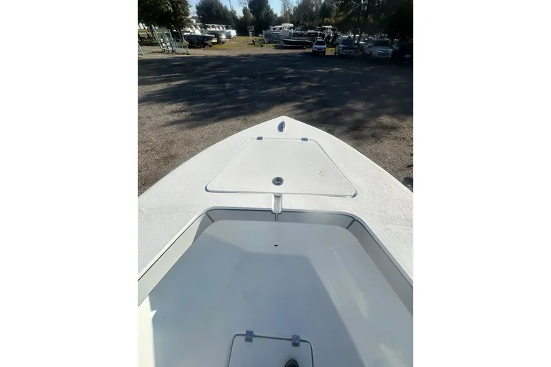 Slide: The Image of 2026 Delta Boatworks Delta D245 bow view in a sunny outdoor setting. - 34