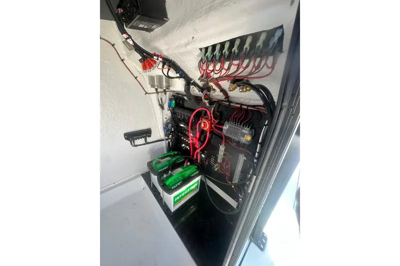 Slide: The Image of Electrical system of 2026 Delta Boatworks Delta D245, featuring batteries and wiring components. - 38