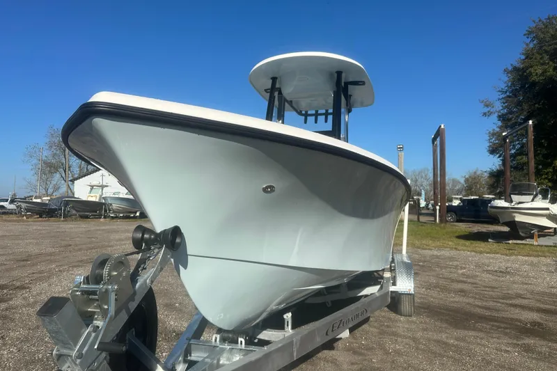 Slide: The Image of 2026 Delta Boatworks Delta D245 on trailer, parked outdoors under clear blue sky. - 4