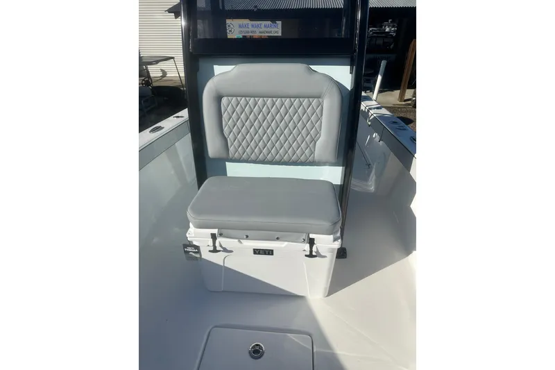 Slide: The Image of 2026 Delta Boatworks Delta D245 seat with Yeti cooler, featuring diamond-patterned upholstery. - 42