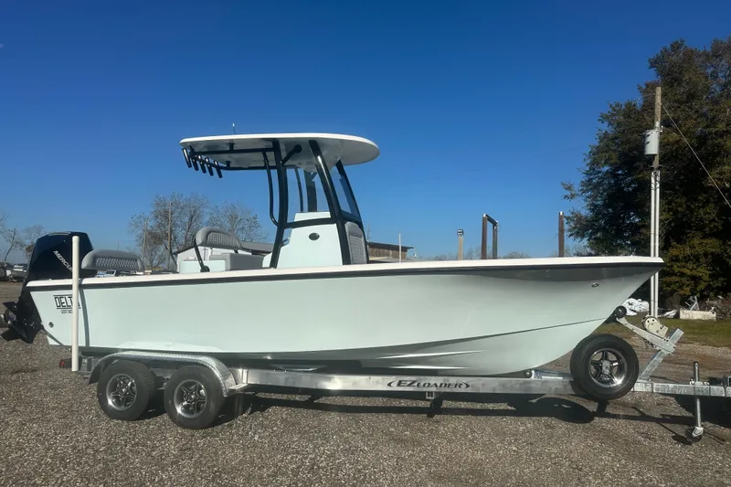 Slide: The Image of 2026 Delta Boatworks Delta D245 on trailer, under clear blue sky. - 6