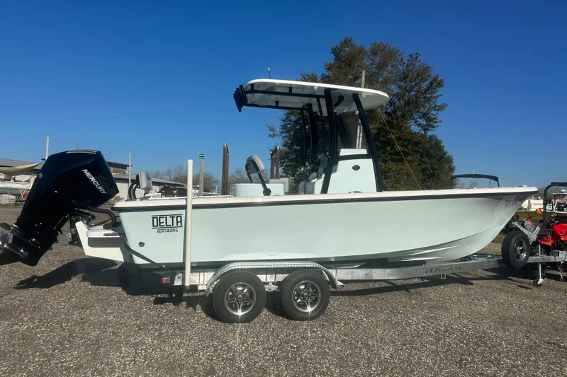 Slide: The Image of 2026 Delta Boatworks Delta D245 on trailer, featuring Mercury outboard motor. - 7