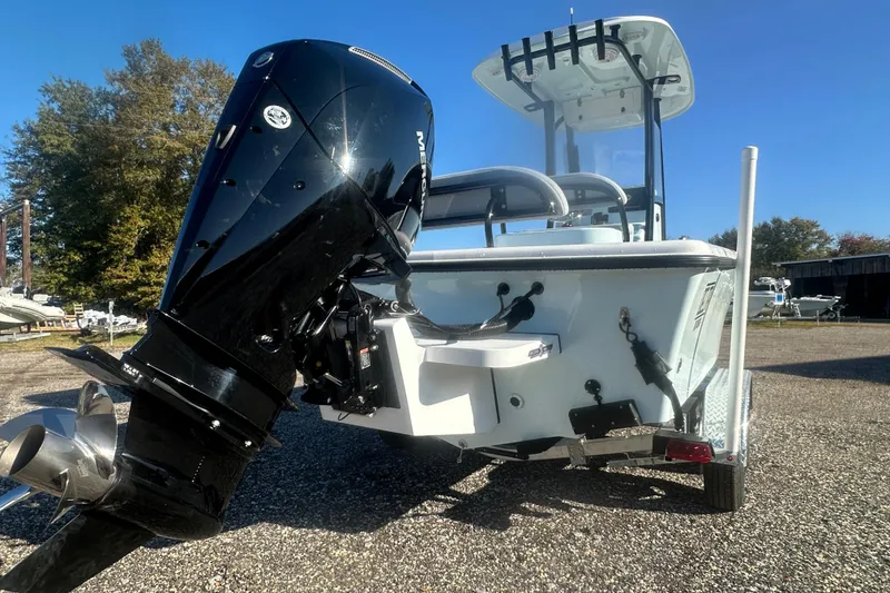 Slide: The Image of 2026 Delta Boatworks Delta D245 with powerful outboard motor, parked outdoors. - 9